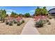 Scenic walking path lined with lush landscaping and native vegetation at 5916 Sorto Lago St, North Las Vegas, NV 89081