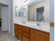 Bright bathroom featuring a dual sink vanity with a neutral color palette and great lighting at 6007 Turtle River Ave, Las Vegas, NV 89156