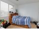 Cozy bedroom with natural light, a comfortable bed, and convenient built-in shelving at 6007 Turtle River Ave, Las Vegas, NV 89156