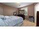 Bedroom features a large dresser and cozy bed at 6007 Turtle River Ave, Las Vegas, NV 89156