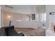Upstairs loft area featuring neutral walls, carpet, and a pendant light fixture at 6007 Turtle River Ave, Las Vegas, NV 89156