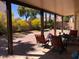 Charming covered patio offering a relaxing outdoor space with views of the landscaped backyard at 6007 Turtle River Ave, Las Vegas, NV 89156