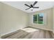 Bright bedroom with wood-look floors, neutral walls, and plenty of natural light at 6035 Shadow Oak Dr, North Las Vegas, NV 89031