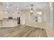 Open dining space with modern flooring, pendant lighting, and an inviting layout at 6035 Shadow Oak Dr, North Las Vegas, NV 89031