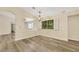 Bright dining room with stylish chandelier, and neutral paint at 6035 Shadow Oak Dr, North Las Vegas, NV 89031