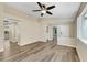 Spacious living room featuring stylish flooring, ceiling fan, and plenty of room to relax at 6035 Shadow Oak Dr, North Las Vegas, NV 89031