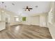 Large open living space with modern flooring, bright interiors, and an open floor plan at 6035 Shadow Oak Dr, North Las Vegas, NV 89031