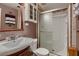 Bathroom featuring a sink, mirror, and stand-up shower with glass sliding door at 6213 Fairwood Ave, Las Vegas, NV 89107