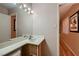 Bathroom featuring single sink vanity with a framed mirror at 6213 Fairwood Ave, Las Vegas, NV 89107