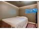 Bedroom with carpet, closet, and a window with natural light at 6213 Fairwood Ave, Las Vegas, NV 89107