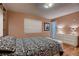 Bedroom with hardwood flooring, dresser, a window with natural light, and decorations at 6213 Fairwood Ave, Las Vegas, NV 89107