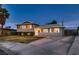 Charming two-story home with a well-manicured lawn and ample driveway space at 6213 Fairwood Ave, Las Vegas, NV 89107