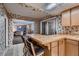 Open kitchen area with bar seating, seamlessly connected to the adjacent living spaces at 6213 Fairwood Ave, Las Vegas, NV 89107