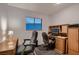 A home office featuring two desks, rolling chairs, and a window with natural light at 6213 Fairwood Ave, Las Vegas, NV 89107