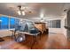 Bright sun room with hardwood floors and floor to ceiling windows offering ample natural light and space at 6213 Fairwood Ave, Las Vegas, NV 89107