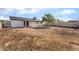 This spacious backyard features mature trees, a covered patio, and a large plot of land at 6444 Bannock Way, Las Vegas, NV 89107