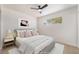 This modern bedroom with comfortable decor features a ceiling fan and plenty of natural light at 6444 Bannock Way, Las Vegas, NV 89107