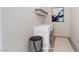 Functional laundry room with side-by-side washer and dryer, shelf storage and convenient layout at 6444 Bannock Way, Las Vegas, NV 89107