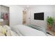 This room features a spacious closet, modern television, and decoratively appealing plant at 6444 Bannock Way, Las Vegas, NV 89107