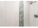 Shower with modern tile accents and rainfall shower head at 6444 Bannock Way, Las Vegas, NV 89107