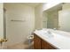 Well-lit bathroom featuring a single sink vanity and tiled flooring and shower at 6459 Rusticated Stone Ave # 103, Henderson, NV 89011