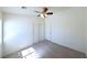 Comfortable bedroom with carpet flooring, ceiling fan, and natural light from a large window at 6459 Rusticated Stone Ave # 103, Henderson, NV 89011