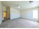 Bright bedroom featuring neutral carpet, ceiling fan, ample natural light from one window at 6459 Rusticated Stone Ave # 103, Henderson, NV 89011