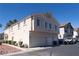 Two-story townhome with a two car garage and well maintained landscaping at 6459 Rusticated Stone Ave # 103, Henderson, NV 89011