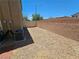 Gravel backyard featuring an air conditioner at 6824 Briarwood Bend Ave, Las Vegas, NV 89130