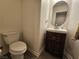 Small bathroom featuring a single sink vanity and a toilet at 6824 Briarwood Bend Ave, Las Vegas, NV 89130