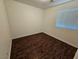 Bedroom featuring wood floors and one window for natural light at 6824 Briarwood Bend Ave, Las Vegas, NV 89130
