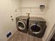 Laundry room with side-by-side washer and dryer at 6824 Briarwood Bend Ave, Las Vegas, NV 89130