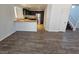 Open-concept living room with stairs to the second floor and kitchen at 6824 Briarwood Bend Ave, Las Vegas, NV 89130
