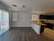 Spacious living room features a modern design and adjacent kitchen at 6824 Briarwood Bend Ave, Las Vegas, NV 89130