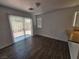 Bright living room leads to private back patio, features hardwood flooring at 6824 Briarwood Bend Ave, Las Vegas, NV 89130
