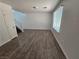 Cozy living room features new hardwood floors and abundant sunlight at 6824 Briarwood Bend Ave, Las Vegas, NV 89130