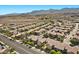 View of the home in the neighborhood with mature landscaping, mountain views, and well-maintained streetscapes at 6868 Sky Pointe Dr # 2035, Las Vegas, NV 89131