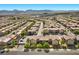 Residential homes with manicured landscaping in a neighborhood with trees and well maintained streetscapes at 6868 Sky Pointe Dr # 2035, Las Vegas, NV 89131