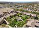 Wide aerial shot showcases a residential area with community park, homes with desert landscaping and mountain views at 6868 Sky Pointe Dr # 2035, Las Vegas, NV 89131