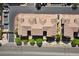 An aerial view of a well-maintained townhouse complex featuring tile roofs and manicured landscaping at 6868 Sky Pointe Dr # 2035, Las Vegas, NV 89131