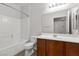 The bathroom features a shower-tub combo, toilet, and dark wood vanity at 6868 Sky Pointe Dr # 2035, Las Vegas, NV 89131