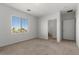 Bedroom with neutral walls, carpet, and en suite bathroom access, offers great privacy and comfort at 6868 Sky Pointe Dr # 2035, Las Vegas, NV 89131