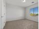 Well-lit bedroom featuring neutral walls, carpet, and a window with outside view at 6868 Sky Pointe Dr # 2035, Las Vegas, NV 89131