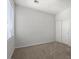 Bedroom with neutral walls, carpet, a window, and closet creates a simple and functional space at 6868 Sky Pointe Dr # 2035, Las Vegas, NV 89131