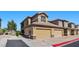 Attractive condo boasts private garages, easy access parking, neutral exterior tones and desert landscaping at 6868 Sky Pointe Dr # 2035, Las Vegas, NV 89131