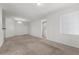 Bright and spacious living room with neutral paint, carpet, and a large window for natural light at 6868 Sky Pointe Dr # 2035, Las Vegas, NV 89131