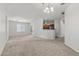 This bright living room features neutral carpet and paint, and abundant natural light at 6868 Sky Pointe Dr # 2035, Las Vegas, NV 89131