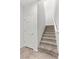 The staircase features carpeted steps and white trim along the walls at 6868 Sky Pointe Dr # 2035, Las Vegas, NV 89131