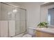 Bright bathroom featuring a shower/tub combo with glass door and neutral vanity at 6955 N Durango Dr # 1093, Las Vegas, NV 89149