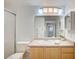 Well-lit bathroom featuring a shower with sliding glass doors, a single sink vanity, and ample counter space at 6955 N Durango Dr # 1093, Las Vegas, NV 89149